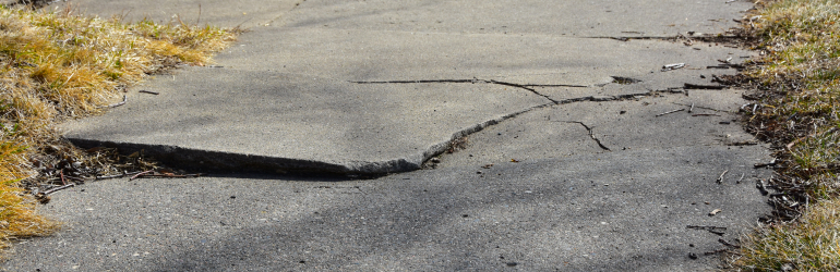 A road with a large crack in it.
