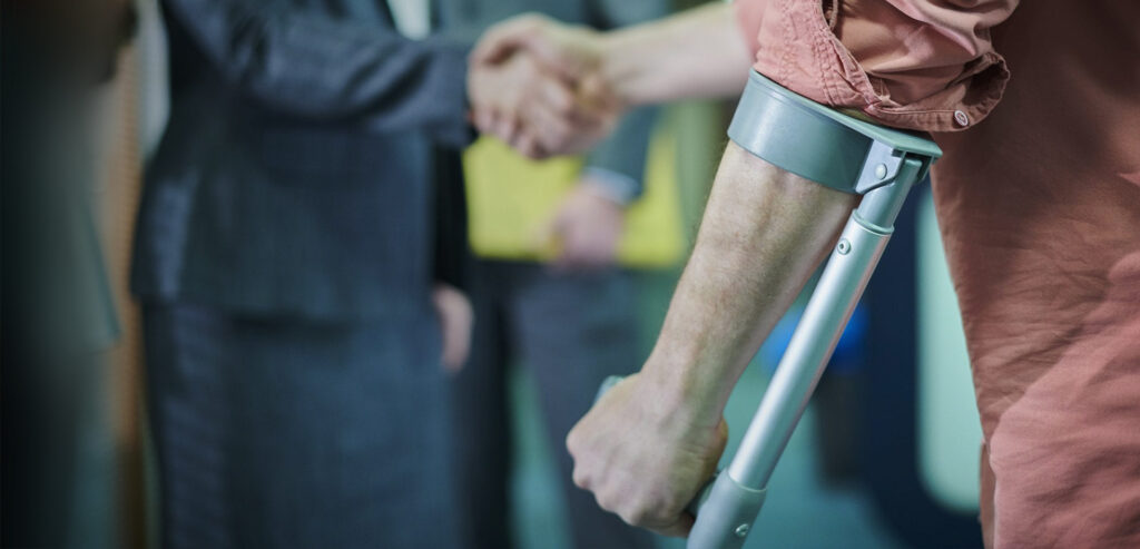 personal injury attorney shaking hands with injured person