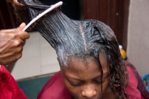 hair dresser relaxing hair