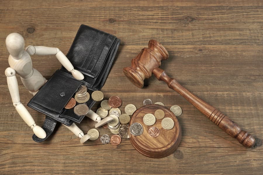 wallet and jury hammer on table