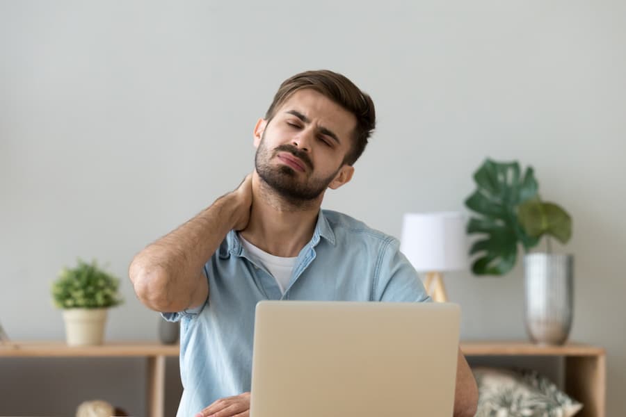 stressed man with neck pain