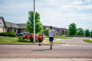 kid chasing a ball