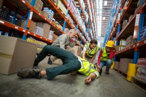 workers taking care of injured colleague