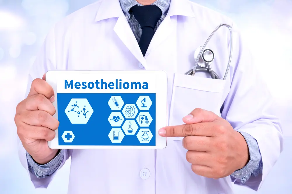 doctor holding tablet with mesothelioma on screen