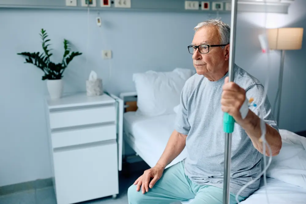 senior man sitting on hospital