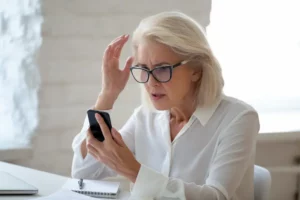Old Person Holding Smartphone