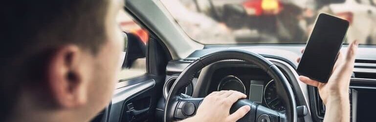 Distracted Uber driver using phone before a car accident in Greensboro, NC