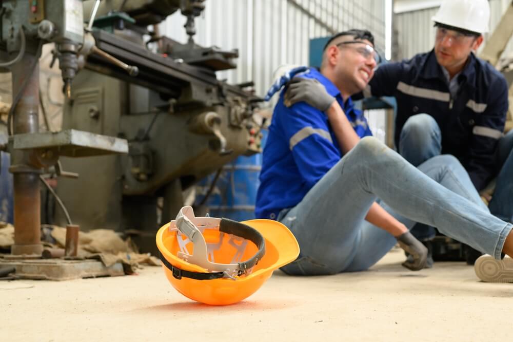 Industrial accident, worker with Accident injury from machine working.