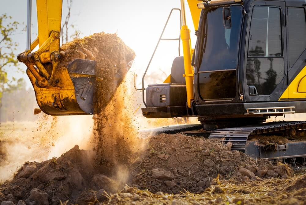Excavator at work – relevant image for construction vehicle accident lawyer in Greensboro
