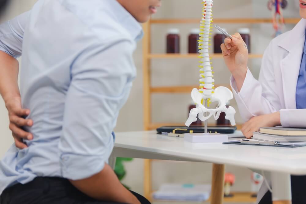Patient with spinal injury consulting doctor – spinal cord injury lawyer in Greensboro NC