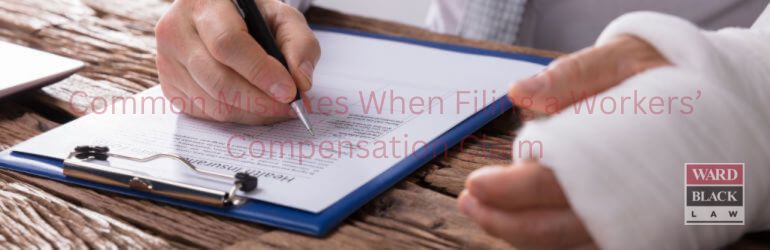 Injured worker with a bandaged arm filling out a North Carolina workers’ compensation claim form