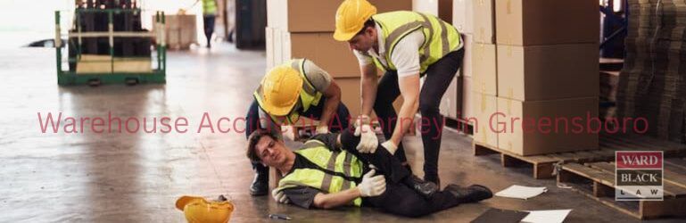 Injured warehouse worker receiving help after a workplace accident in Greensboro, NC warehouse.