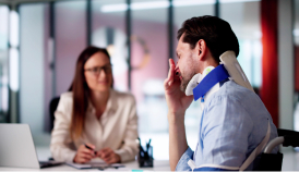 man with an injured neck in consultation with a lawyer